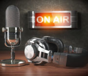 Podcast microphone and headphones beside an illuminated on-air sign - what does the bible say about israel