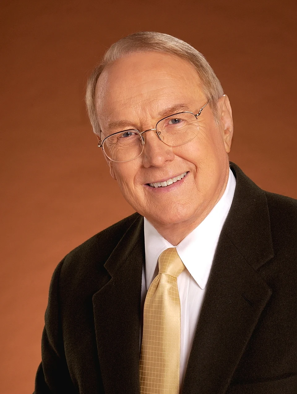 Older man smiling for a studio portrait - biblical predictions
