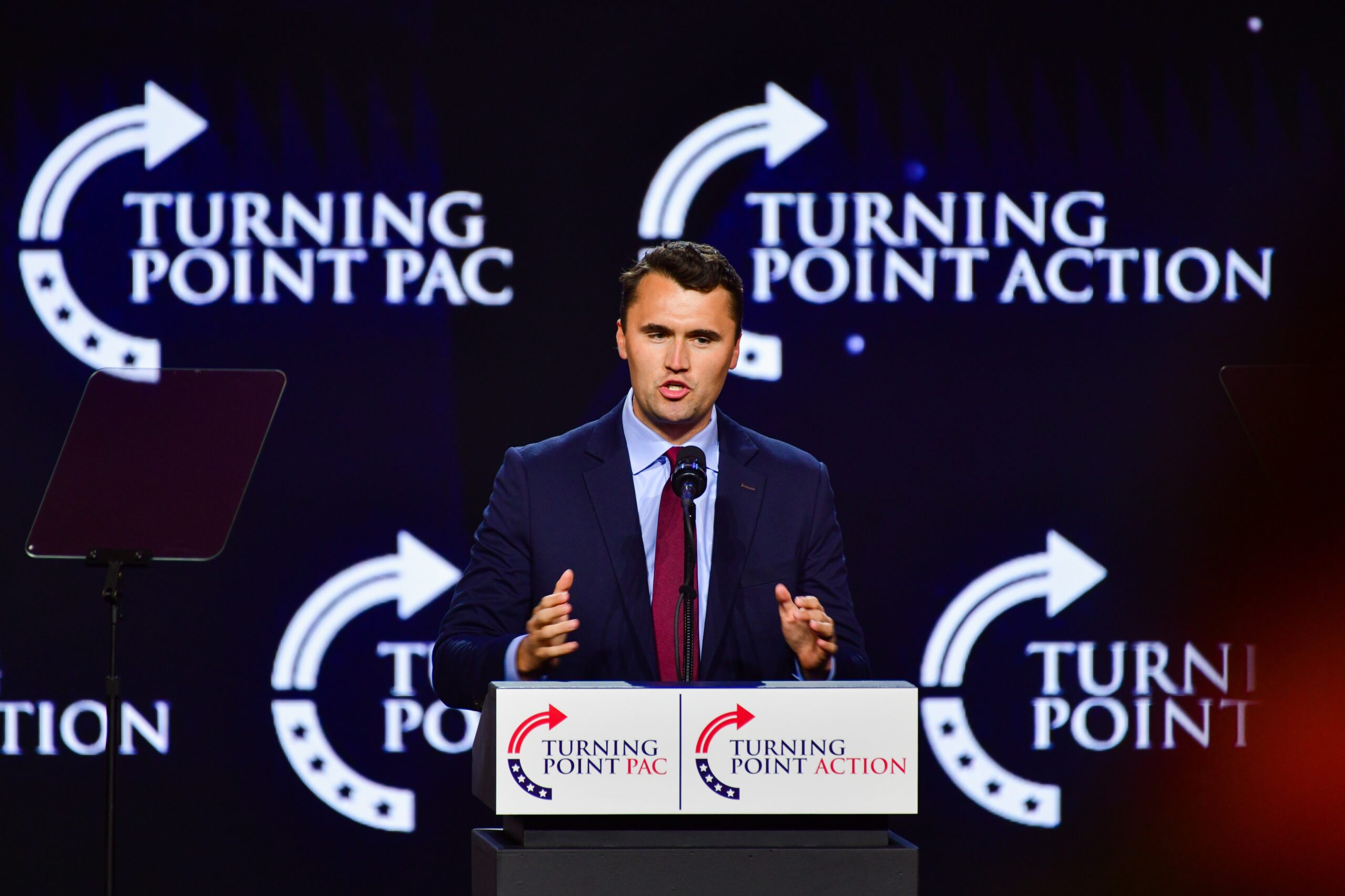 Man speaking at a podium in front of a Turning Point backdrop - book of revelation bible study